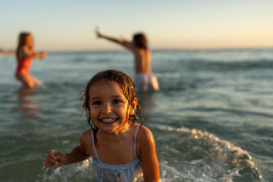 A little girl smiling in the water at sunset. Her siblings at the back playing together. She is really happy.
Pre-Opening picture pool, stock photos
Falkensteiner Resort Lake Garda